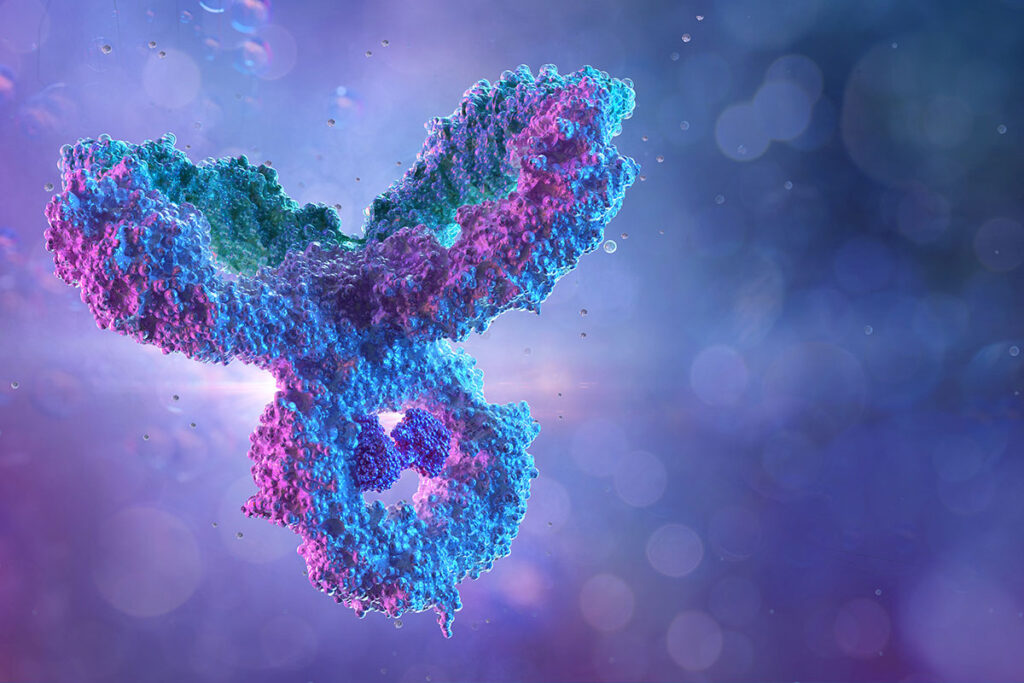 A computer-generated 3D illustration of a monoclonal antibody, showing a highly magnified Y-shaped protein structure used in immunotherapy and infectious disease treatment. The background is abstract and blurred to emphasize the molecular detail.